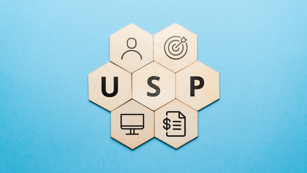 A blue background with wood tiles that make up a hexagon and the letters USP in the center